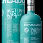 A premium Bottle of Bruichladdich Scottish Barley, The Classic Laddie, stands elegantly beside its cylindrical box. The packaging boasts a striking light blue hue adorned with crisp white text and intricate detailing, symbolizing the high value and quality associated with whisky investments.