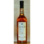 A bottle of Clynelish 14-year-old single malt Scotch whisky, perfect for savvy whisky investment enthusiasts, features a distinguished black cap and is elegantly set against a quality wooden backdrop.