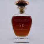 Explore the GlenGrant 70, a prestigious whisky investment opportunity. This exquisite 70-year-old single malt Scotch from Glen Grant Distillery, crafted by Gordon & MacPhail, showcases its quality with a cork stopper and copper-colored cap.