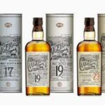 A collection of eight exquisite Craigellachie Cask Whisky Investment bottles, showcasing unique ages and distinctive labels, is elegantly arranged with their matching premium packaging, epitomizing high-value whisky investments.
