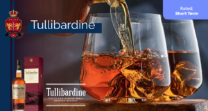 A close-up captures Tullibardine whisky elegantly pouring over ice into two glasses, with the premium bottle and decorative box showcased on the left, highlighting its value for whisky investing.