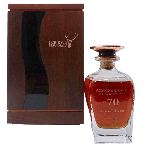 This high-quality image features a rare bottle of Gordon & MacPhail 70-year-old single malt Scotch whisky alongside an elegant wooden presentation box. This exceptional collectible represents one of the best investments in premium whisky, perfect for any whisky investor or enthusiast looking to enhance their portfolio.