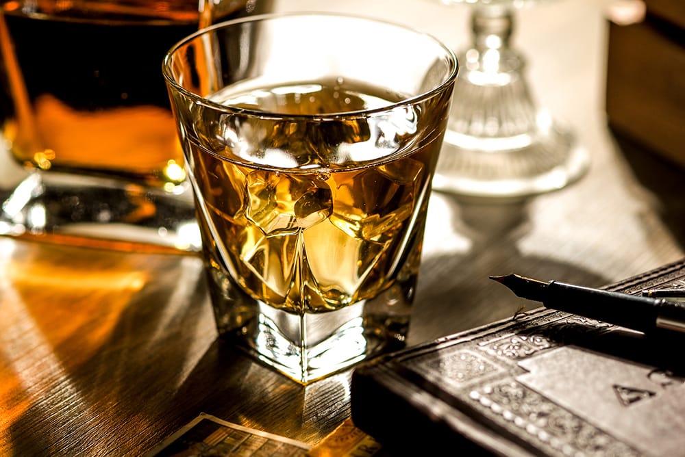 Glass of rare whisky secondary investment market