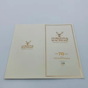 This close-up highlights the premium Gordon & MacPhail whisky packaging, showcasing a rare "Aged 70 Years" label and distinct bottle number 103 of 222 from the renowned Glen Grant Distillery, a testament to high-value whisky investing.