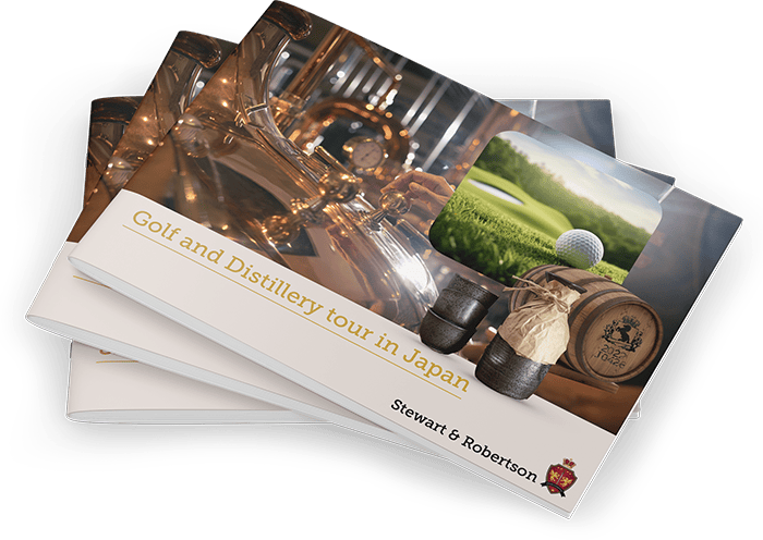 Stack of Stewart & Robertson "Golf and Distillery Tour in Japan" brochures, with whisky barrel, golf, and distillery images on cover.