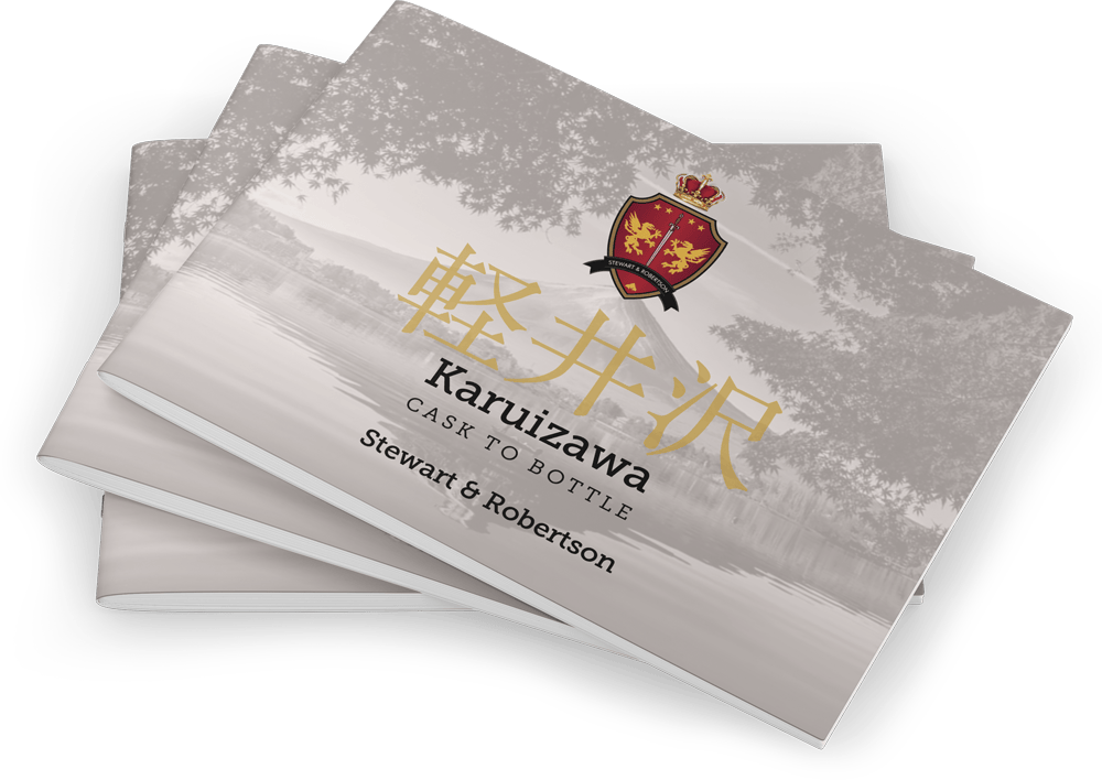 Two premium booklets titled "Karuizawa Cask to Bottle" by Stewart & Robertson, with whisky crest and Japanese script on the cover.